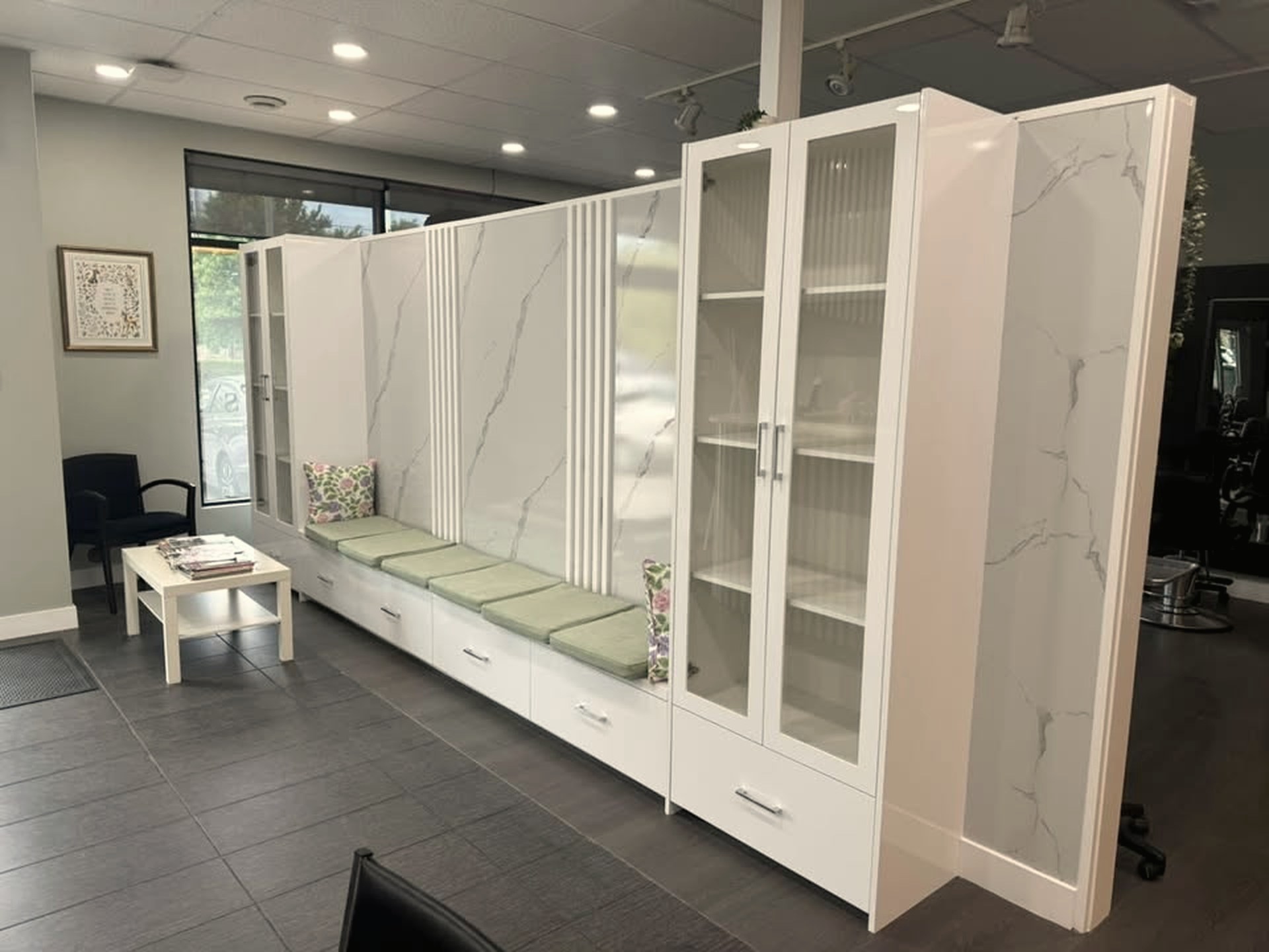 Comfortable waiting area with marble cabinetry